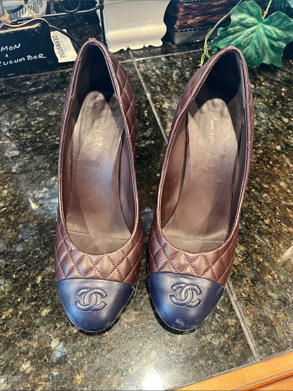 CHANEL Quilted Brown Leather Pumps with Black Cap Toe